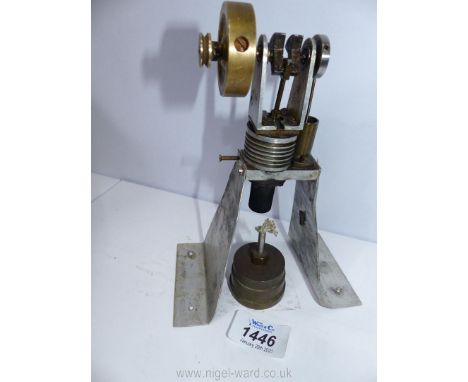 A model of a vertical cylinder Hot Air/Sterling cycle stationary Engine on aluminium plate supports, 7'' high, the brass fly 