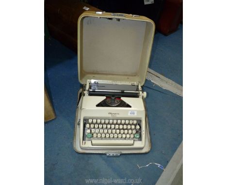 A cased Olympia 'Monica' typewriter made in Western Germany, (handle a/f).