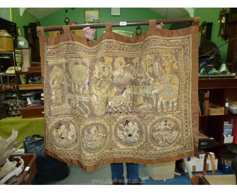 A large Burmese Kalga tapestry elaborately worked with metal threads and sequins with a pattern depicting a Royal procession 