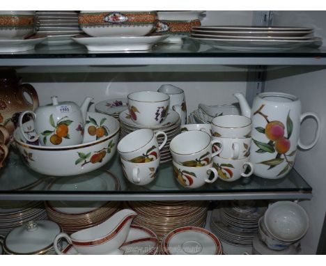 A quantity of Royal Worcester Evesham including, Two flan dishes, large fruit bowl, milk jug, sugar bowl, tea pot (crack to h