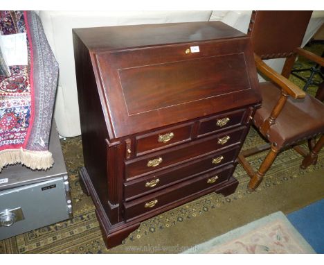 A contemporary dark Mahogany Bureau, the slope front opening to reveal a nicely fitted interior with drawers, pigeon holes an