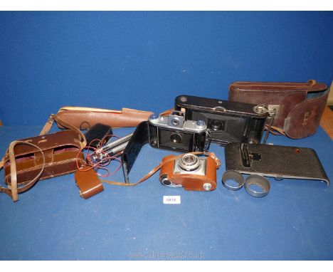 A quantity of Cameras including Epsilon in leather case, Kodak Retinette , Kodak no. 3A folding pocket camera, Velbon tripod,