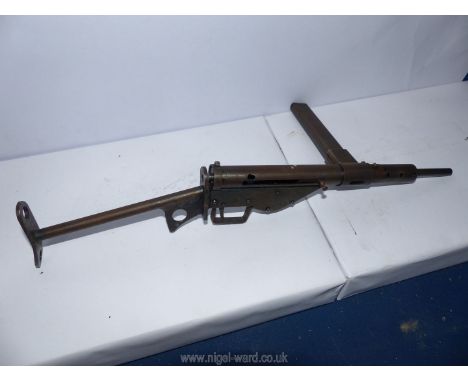 An engineer made miniature replica of a Sten Gun, magazine removes, cocks and triggers but is a non-operative model, 15 3/4''