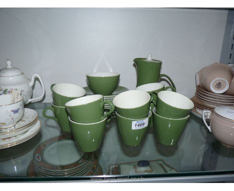 A quantity of Poole Pottery coffee ware in Forest Green including cups, saucers, sugar bowl and coffee pot.