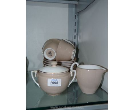 A part Royal Worcester Teaset in cream and beige including a lidded sugar pot, milk jug, five saucers, four tea plates, four 