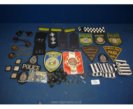 A quantity of fabric sew on badges: Polizei, Leominster Police, Sheriff Dept, Stars on fabric panels and Policeman numbers an