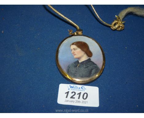 An oval Portrait Miniature of a lady in blue dress in silver gilt mount, London 1896 with indistinct inscription verso ''Harr