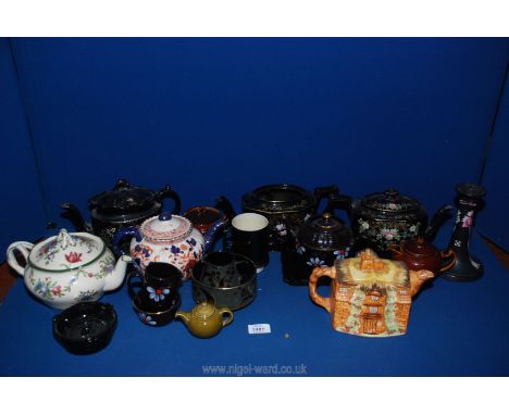 A quantity of teapots and miscellaneous china including, black Chatsworth teapots, a cottage teapot, an Imari style teapot, a