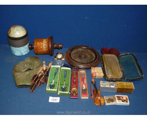 A wooden cigarette and ashtray, six feather darts, a boxed small Universal globe, miniature clock etc.