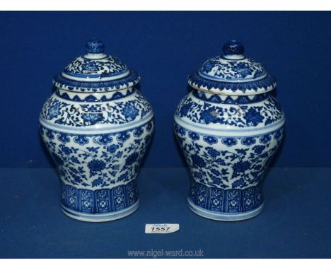 Two Chinese blue &amp; white covered jars, seal marks in blue to bases. 8 1/2'' tall, (one jar with repair to rim)