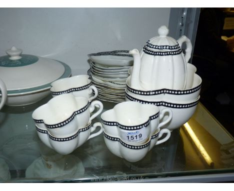 A pretty Coalport part tea service in quatrefoil shape with black and white border on a white ground.