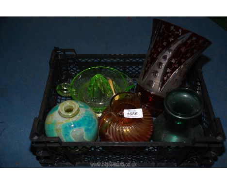 A large cranberry cut glass vase, Uranium orange squeezer, coloured balloon vase, brown jug,  etc.