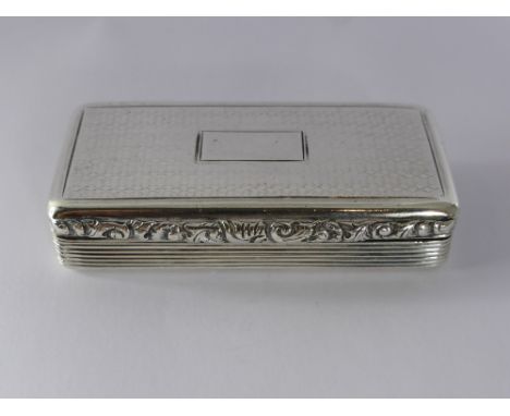 A Silver Snuff Box, Birmingham 1840 mm William Simpson, engine turned cover and side with foliate thumb piece.