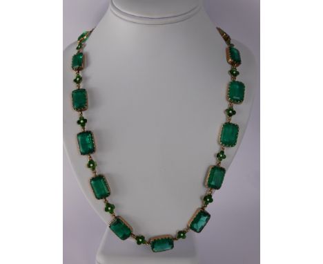 An 18th Century Style 9 ct Gold Faux Emerald Glass and Enamel Necklace. The necklace having eighteen rectangular stones of va