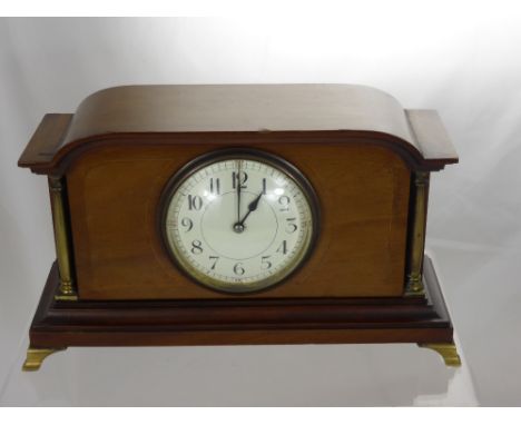 A Mahogany Mantel Clock, with brass pillar supports, cream enamel dial.