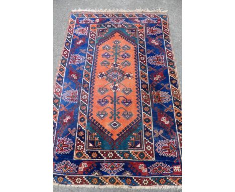 An Antique Woollen Shiraz Carpet, having central ghoul cartouche with tribal stylised border, approx 123 x 15 cms.