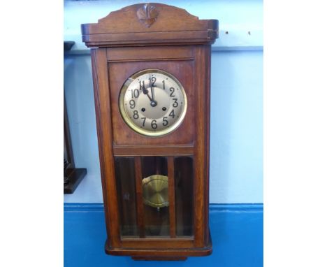 An Edwardian Oak American Style Long Wall Clock, the clock having three bevelled glass panels to front, approx 85 cms high.
