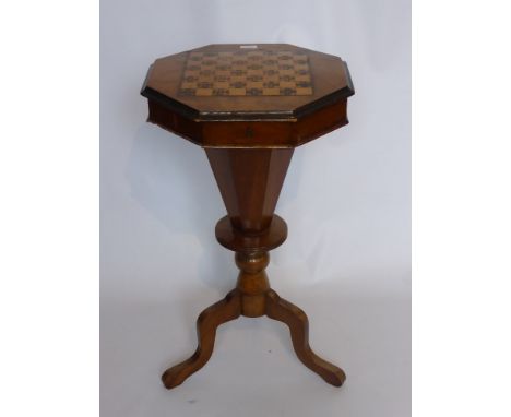 An Octagonal Walnut/Mahogany Inlaid Sewing/GamesTable, the sewing box on tripod base.