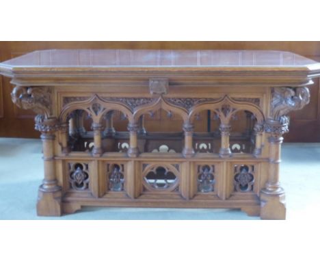 A Gothic Circa 1900 Oak Sepulchre Altar Table, the front and back having carved open arch design with turned columns standing