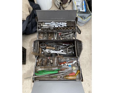 A METAL TOOL BOX WITH AN ASSORTMENT OF TOOLS TO INCLUDE SPANNERS, ALAN KEYS AND A WIRE BRUSH ETC 