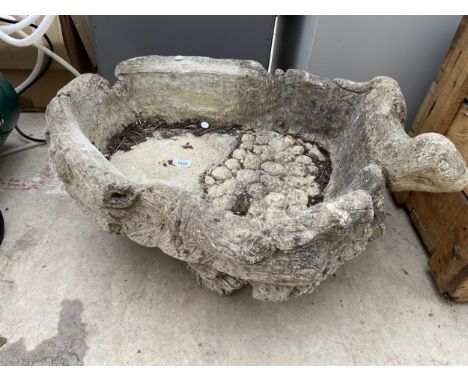 A RECONSTITUTED STONE PLANTER WITH BASE AND OTTER DECORATION 