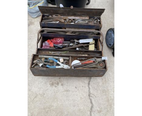 A METAL TOOL BOX WITH AN ASSORTMENT OF TOOLS TO INCLUDE SPANNERS AND SOCKETS ETC 