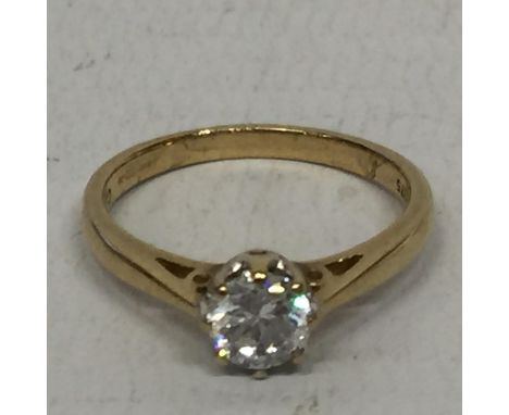 A 9 CARAT GOLD RING WITH A SOLITAIRE CUBIC ZIRCONIA SIZE J/K 