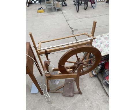 A MODERN SPINNING WHEEL AND TAPESTRY STAND 