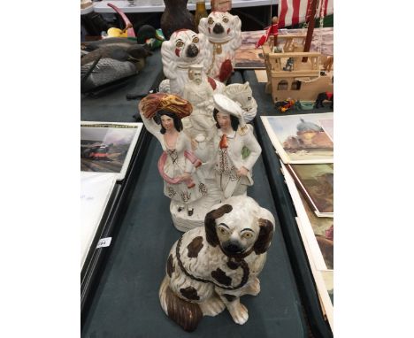 A QUANTITY OF VINTAGE STAFFORDSHIRE LARGE FIGURES TO INCLUDE THREE MANTLE DOGS, LORD KITCHENER AND A COUPLE - SOME A/F 