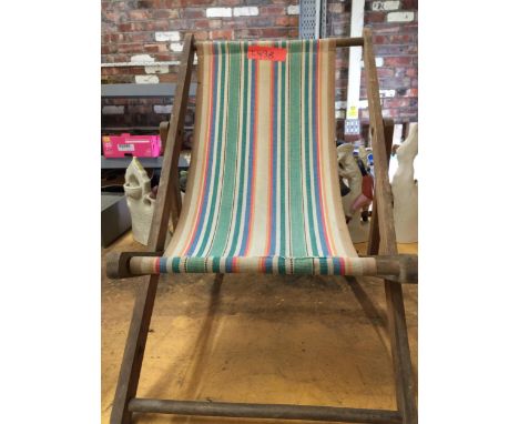 A VINTAGE CHILDREN'S DECKCHAIR WITH STRIPED FABRIC 