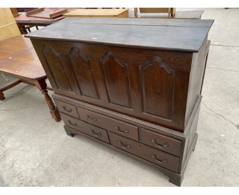 A GEORGE III WELSH OAK BLANKET CHEST WITH FOUR PANEL FRONT ON BASE, ENCLOSING TWO SHORT AND THREE LONG DRAWERS, ON BRACKET FE