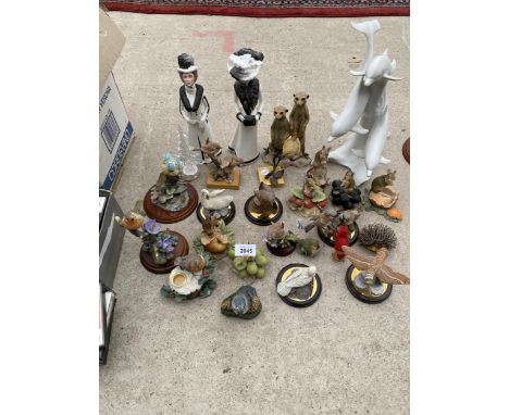 A LARGE ASSORTMENT OF CERAMIC ANIMAL FIGURES TO INCLUDE BIRDS ETC 
