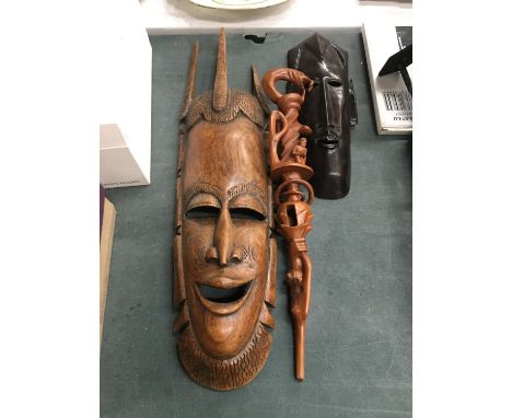 TWO AFRICAN STYLE FACE MASKS PLUS A TRIBAL STYLE CARVED STICK WITH SERPENT DESIGN 