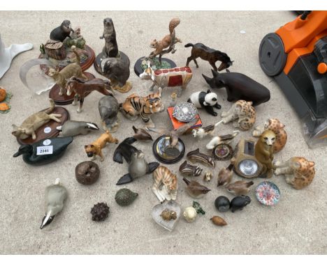A LARGE ASSORTMENT OF CERAMIC ANIMAL FIGURES TO INCLUDE BIRDS ETC 