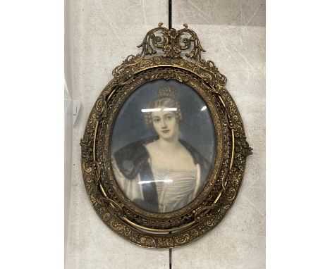AN EARLY 19TH CENTURY HAND PAINTED PORTRAIT OF A LADY, SIGNED M.STIELER, IN ORNATE BRASS OVAL FRAME AND STAND, LENGTH 13CM 