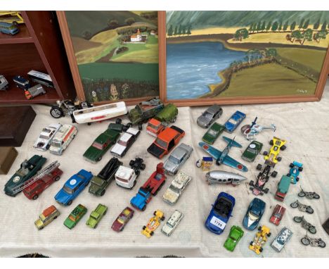 A LARGE ASSORTMENT OF VINTAGE DIE CAST VEHICLES AND PLANES ETC 
