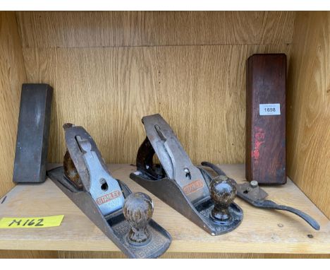 AN ASSORTMENT OF VINTAGE WOOD PLANES AND TWO SHARPENING STONES 