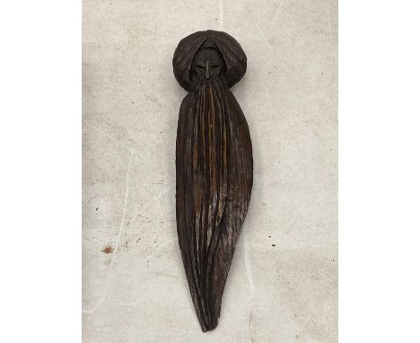 A VINTAGE CARVED WOODEN LETTER OPENER IN THE GUISE OF A HOLY MAN 