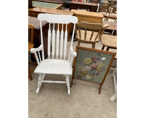 A MODERN WHITE PAINTED ROCKING CHAIR AND WOOLWORK FIRE SCREEN 