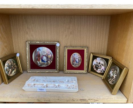AN ASSORTMENT OF FRAMED CERAMIC PLAQUES AND A RELIGIOUS SCENE 