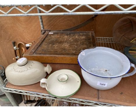 AN ASSORTMENT OF VINTAGE ITEMS TO INCLUDE A GILOTINE AND A HOT WATER BOTTLE ETC 