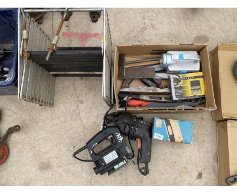 AN ASSORTMENT OF TOOLS TO INCLUDE AN ELECTRIC DRILL, AN ELECTRIC JIGSAW AND RASPS ETC 