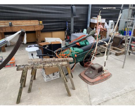 A LARGE ASSORTMENT OF GARDEN TOOLS TO INCLUDE, FLYMO, LEAF BLOWERS, WHEELBARROW, ETC 
