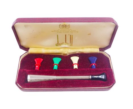 Mid 20th century silver cigarette holder, with engine turned decoration and multicoloured interchangeable mouthpieces, hallma