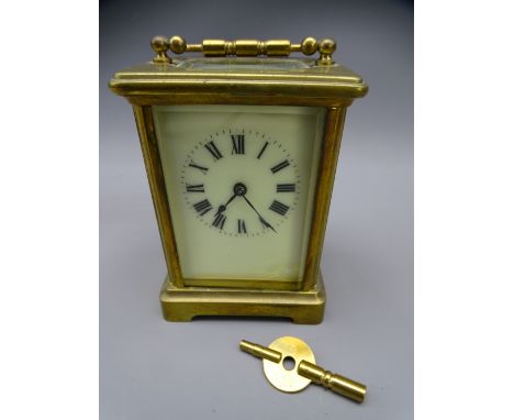 FRENCH BRASS CASED CARRIAGE CLOCK with key, 14cms H handle up