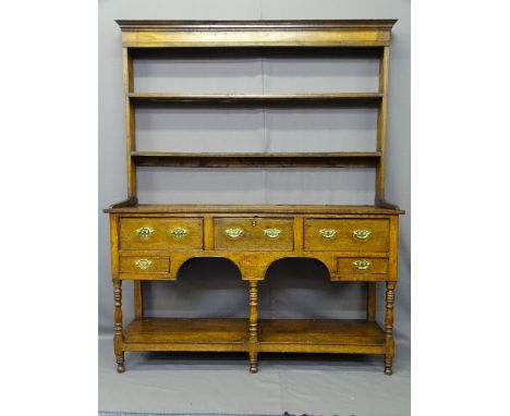 SHROPSHIRE OAK POTBOARD DRESSER, having two shelf open back rack with elongated shoes over a base arrangement of three frieze