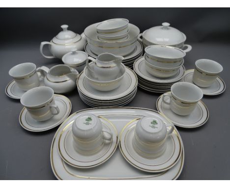 GILT LINE WHITE PORCELAIN TABLEWARE - a quantity marked 'JLMENAU - made in German Democratic Republic', to include teapot, co