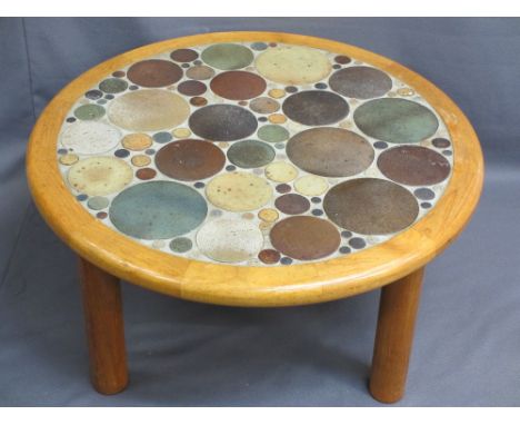 STYLISH MID CENTURY CIRCULAR COFFEE TABLE set with circular pottery discs of various sizes, framed in light oak on substantia