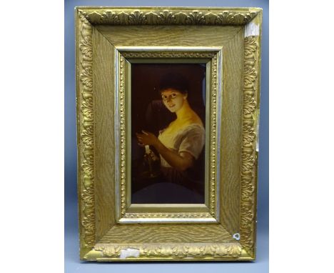 GILT FRAMED EDWARDIAN CRYSTOLEUM of a young girl holding a lit candlestick, 23.5 x 12.5cms