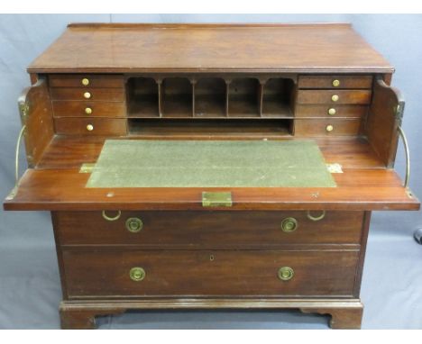 CIRCA 1840 MAHOGANY SECRETAIRE CHEST having ring pull brassware to a drop down dummy drawer front and fitted interior, above 